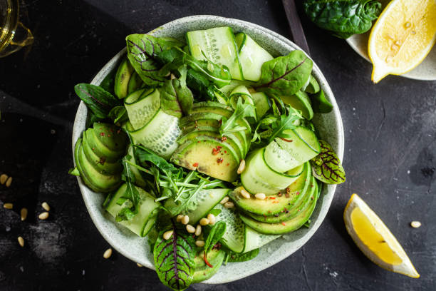 istock Vegetarian salad with avocado, cucumber and herbs 1370165241