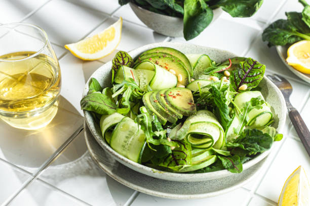 istock Vegetarian salad with avocado, cucumber and herbs 1370165338