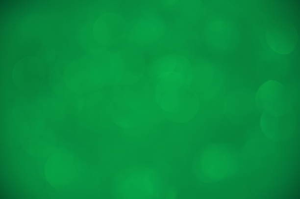 Color background.Holiday template. Bokeh on a colored background.