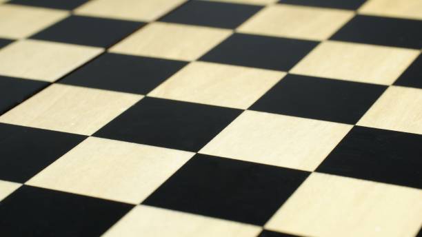 istock Chess board closeup with black and white squares 1370166608