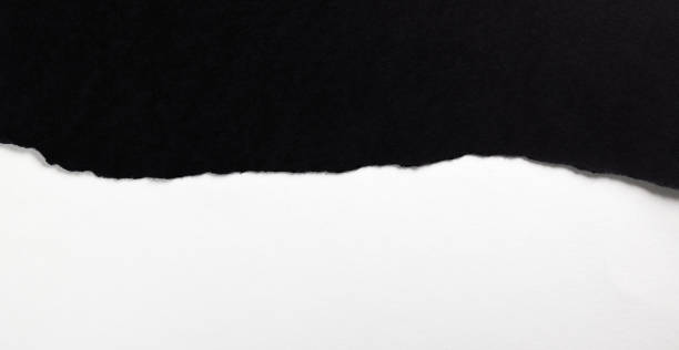 istock Black paper with torn edges isolated with white colored paper background inside. Good paper texture 1370166839