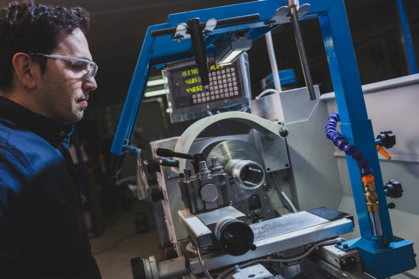 istock Mechanical technician operative of CNC milling cutting machine center at tool workshop. 1370167765