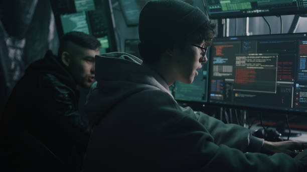 istock Young cybercriminals hacking secret data 1370169737