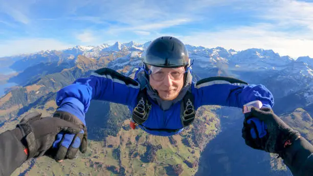 Photo of Skydivers fall through clear skies, aerial flight