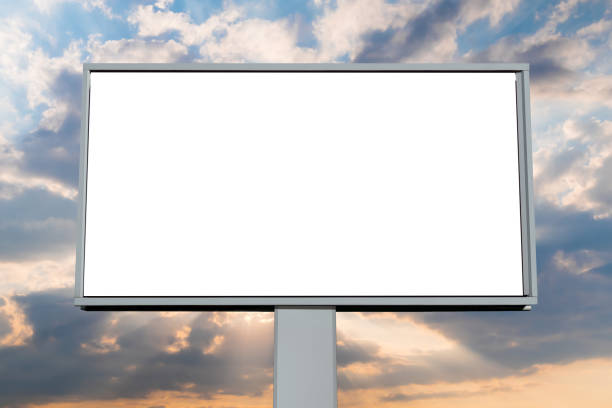 istock Front view: blank white billboard against warm sunset sky with clouds - mock up 1370173832
