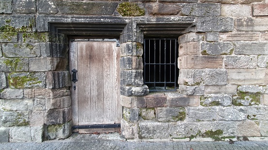 Castle door and window with bars