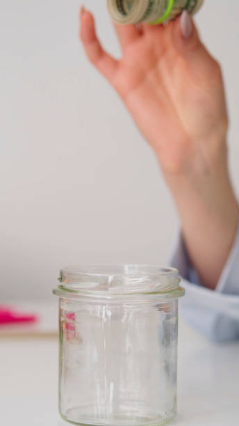 istock dollar money in glass 1370178711