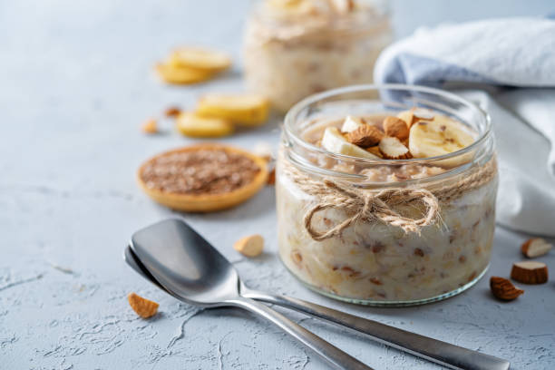 Banana flax seeds overnight oats with banana slices and almonds stock photo