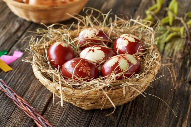 istock Easter eggs dyed with onion peels in a basket on a rustic table 1370180296