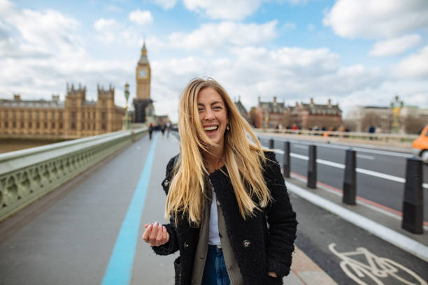 istock Woman having fun on Westminster Bridge 1370187103