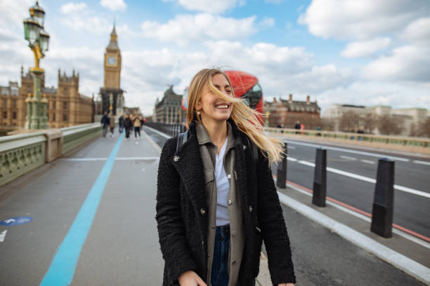 istock Woman having fun on Westminster Bridge 1370187266