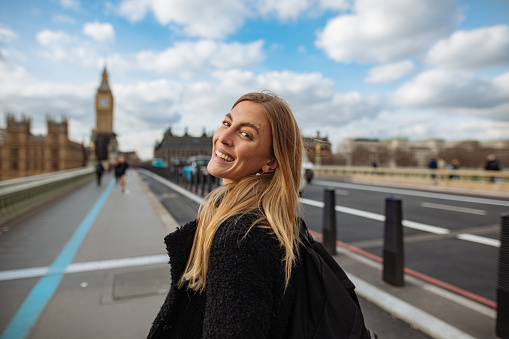 Woman having fun on Westminster Bridge