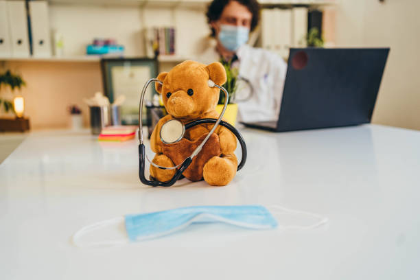istock Teddy bear with stethoscope in the doctor's office 1370188392