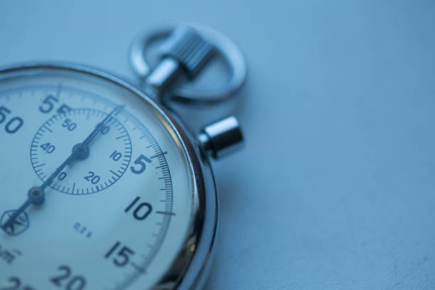 istock Vintage stopwatch counting seconds and minutes, on blue background,  copy space 1370188583