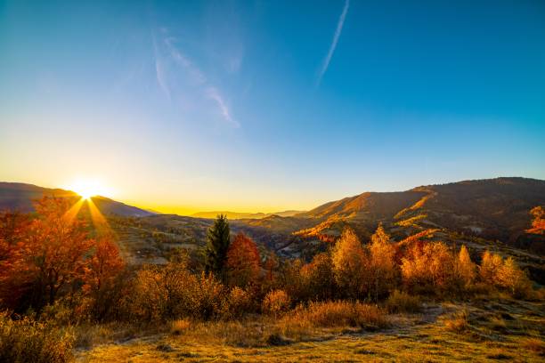 istock Sun sets behind forestry mountains in highland in autumn 1370190107