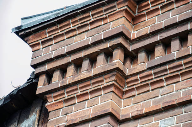 Perspective, side view of old red brick wall texture background.