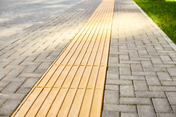 istock Yellow tactile paving on walkway, tactile ground surface indicators for blind and visually impaired 1370192722