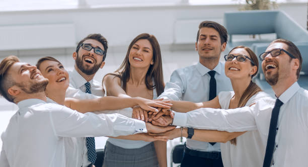 istock happy business team showing their unity and looking up 1370192729