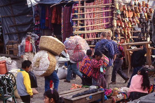 Santo Tomás Chichicastenango, Guatemala - aug 19, 1998: frenetic activities and curious tourists characterize the weekly market of Chichicastenango, one of the most famous in Central America