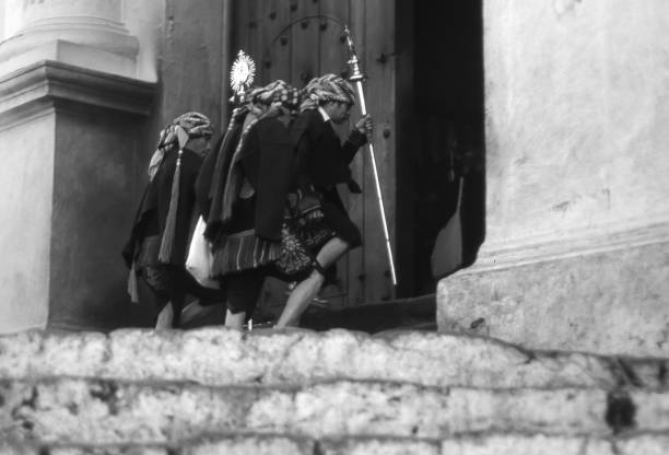 Valencia, Spain - August, 1982: An old woman buys a traditional Spanish lottery to a blind woman who eats a sandwich on August, 1982 in Valencia, Spain. Black and white. the file source is film