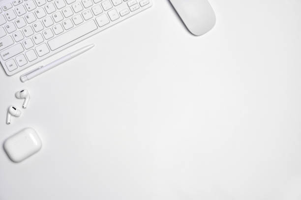 istock Total white workplace table with mouse, keyboard, headphones 1370195344