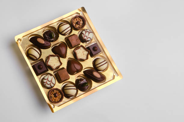 istock set of assorted chocolates in a paper box on a bright background 1370195417