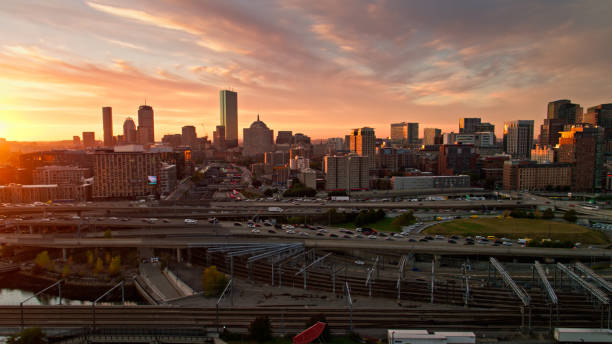 istock Railroad Tracks and Freeway in Boston at Sunset - Aerial 1370200921