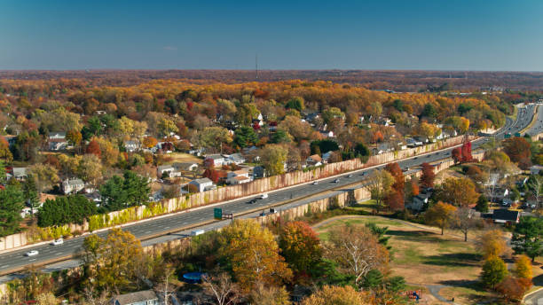 istock Highway Passing Suburban Homes in Maryland 1370201994