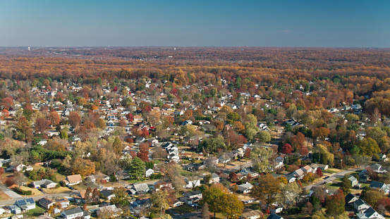 Aerial shot of a residential neighborhood in Bowie, a city in Prince George's County, Maryland on a sunny day in Fall.