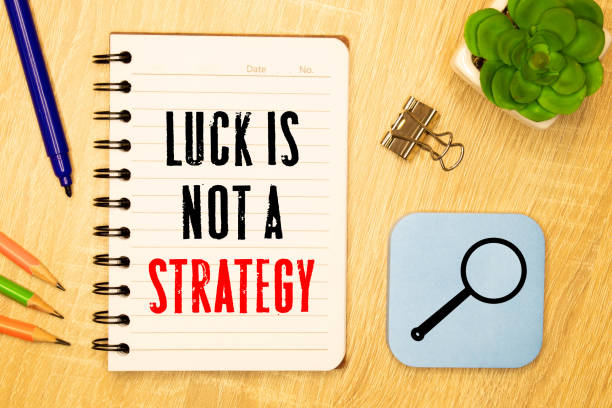 istock Luck Is Not A Strategy text on a notebook on office desk. 1370202539