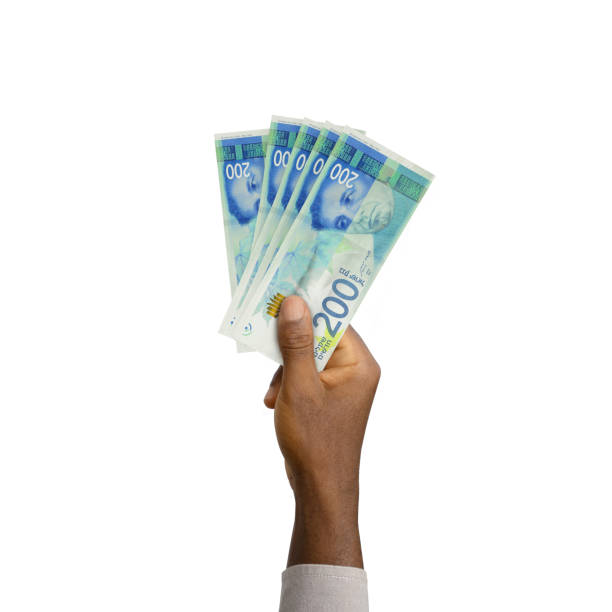 istock Black Hand holding 3D rendered Israeli Shekel notes 1370206850