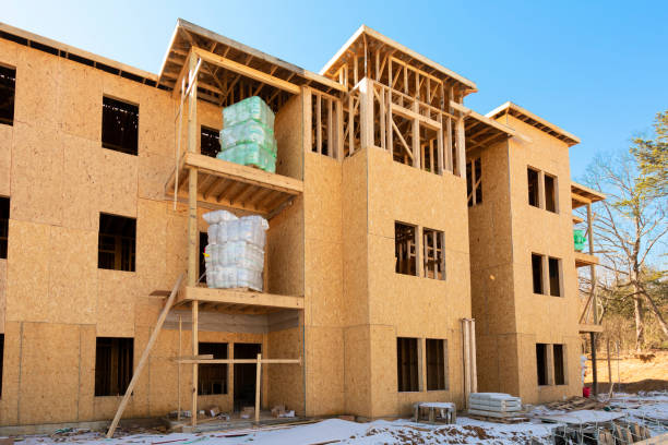 istock Rolls of Insulation Await Installation In New Apartment Complex construction 1370208584