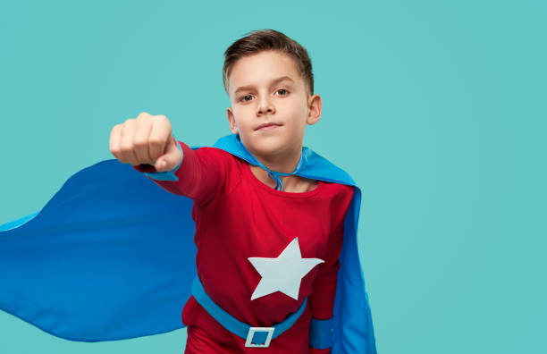 istock Brave boy in superhero costume in studio 1370212150