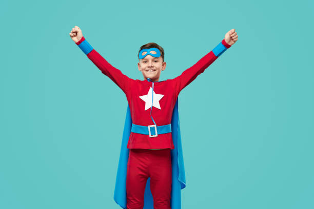 istock Cheerful superhero celebrating success with raised arms 1370212165