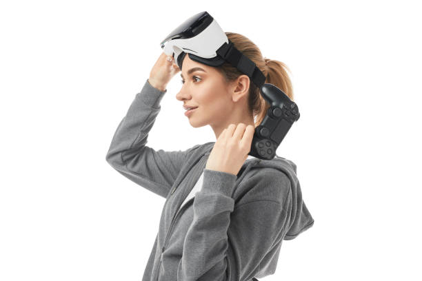 istock Woman in VR goggles and with joystick in studio 1370212193