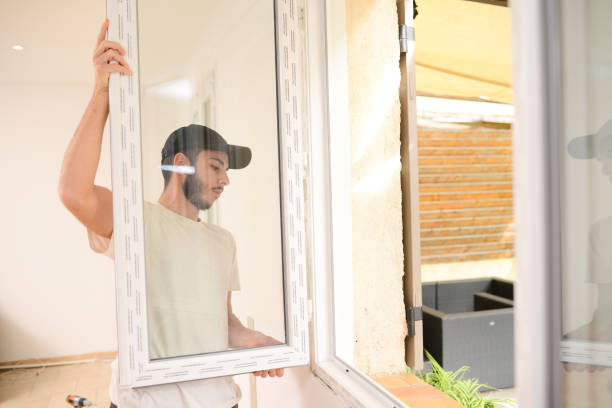 istock handsome young professional man installing and replacing a new home windows in client house for improvement energy saving efficiency isolation 1370212242