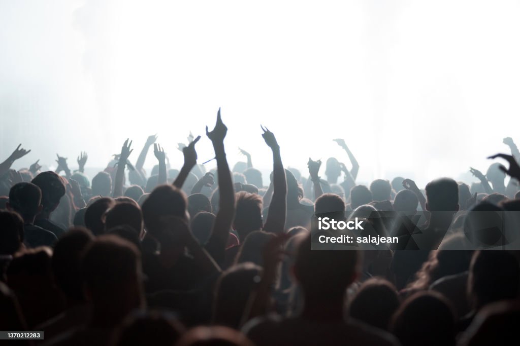 Crowd of people partying at live concert Crowd of people partying at live concert at music festival Crowd of People Stock Photo