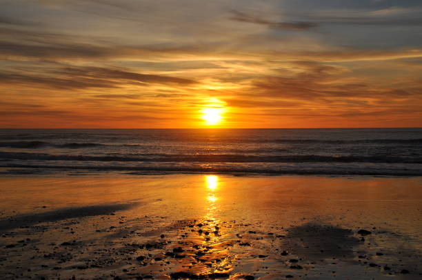 istock Bright Orange Sunset at the Beach 1370213362
