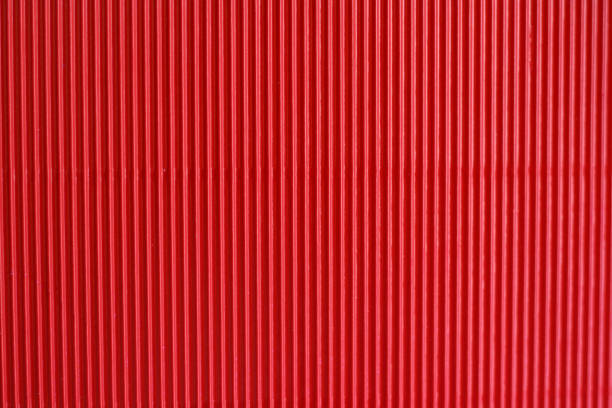 istock Bright red corrugated textured abstract background closeup 1370222409