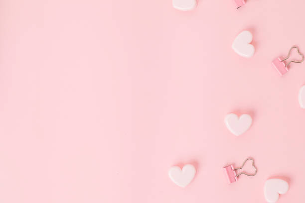 istock little pink hearts on a pink background, topview, flatlay 1370224454