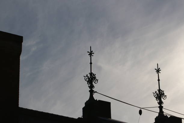 Old red brick warehouse roof top gothic iron ornament design photograph