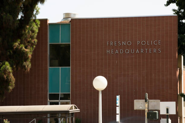 Fresno, California, USA - July 15, 2021: Sun shines on the downtown headquarters of the Fresno Police Department.