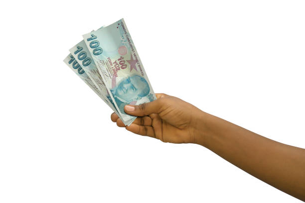 istock Fair hand holding 3D rendered Turkish Lira notes isolated on white background 1370235362