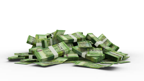 istock 3D Stack of 5000 Guyanese dollar notes isolated on white background. Guyana dollar 1370235965