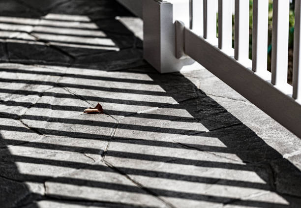 A close-up image of a white porch post on a residential home