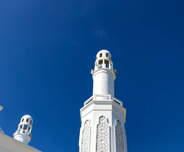 istock White mosque minatet with blue sky backgroud 1370237861