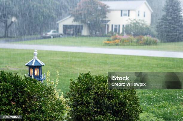 Illuminated Model Lighthouse During Drenching Rain Storm Downpour Stock Photo - Download Image Now