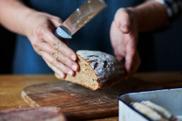 istock person cutting homemade rye bread 1370241325