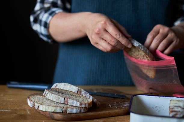 istock person putting sliced rye bread into zip lock bag 1370241326