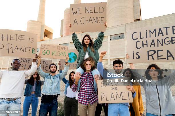 Multiracial People Protest Against Climate Change Holding Signboards In The Street Demonstration To Save The Planet Stock Photo - Download Image Now